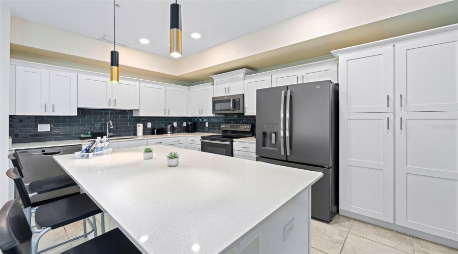 Quartz Counter Tops, Stainless Steel Appliances, Tile Backsplash