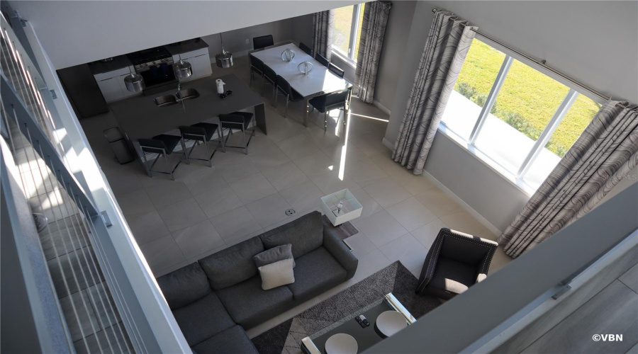 Soaring Ceilings Enhances View Of Kitchen/Living Area.