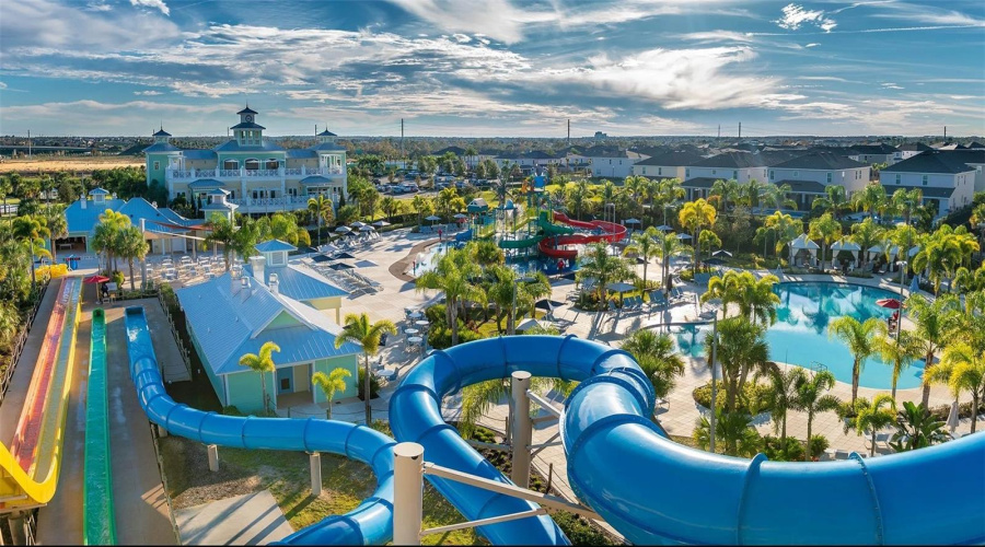 Encore Resort Waterslide With View Of Clubhouse And Community Amenities