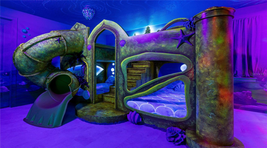 Little Mermaid Themed Combined Bedroom With Custom Murals And Custom Bed With 4 Queen Sized Mattresses. Black Light Reactive Effects.