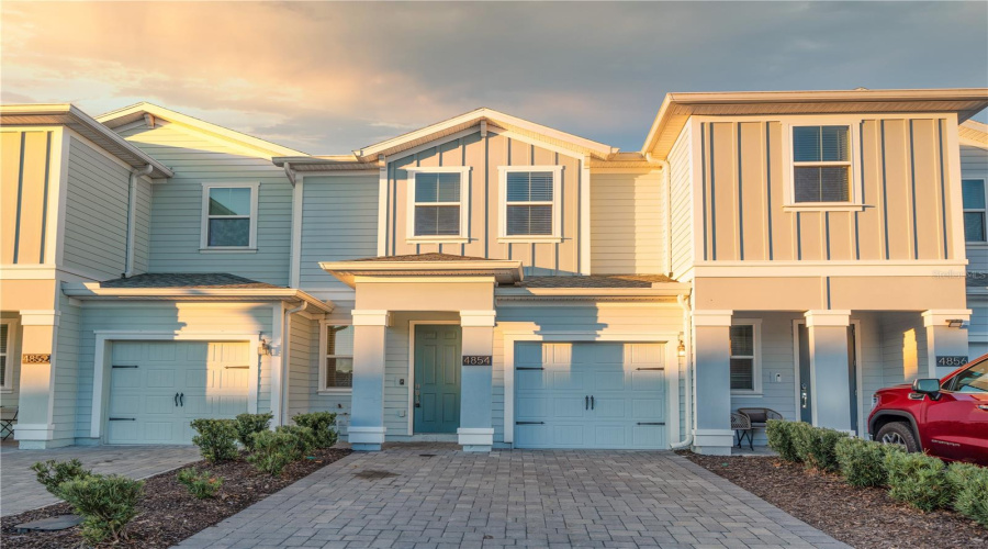 Front With Open Driveway