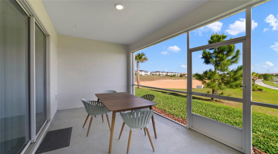 Before Heading Out For The Day Enjoy A Quiet Cup Of Coffee On The Screened Lanai, There Are No Immediate Rear Neighbors Giving You An Open View That Includes Mature Trees And Lush Grass!