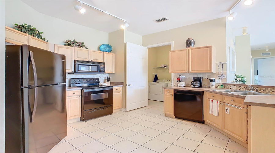 Located Past The Kitchen Area Is An Indoor Laundry Room, Which Makes For Convenience.