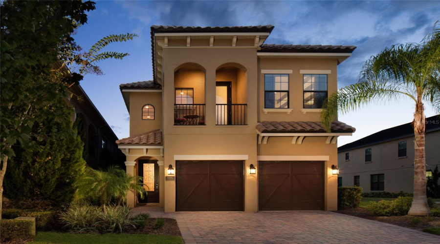 Front Exterior Evening View With Decorative And Security Lighting