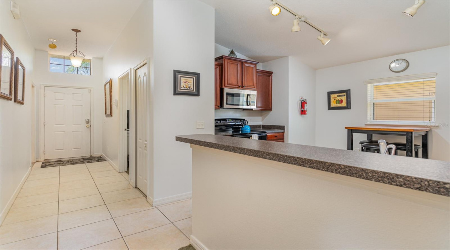 Foyer Entrance And Breakfast Bar At Kitchen