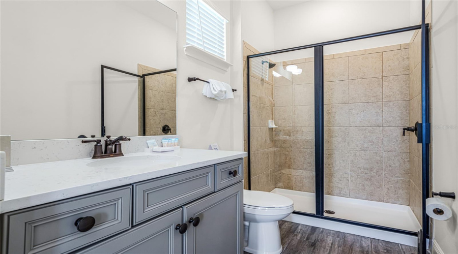 Third Bathroom With Single Sink Vanity Area, And A Glass Enclosed Standing Shower