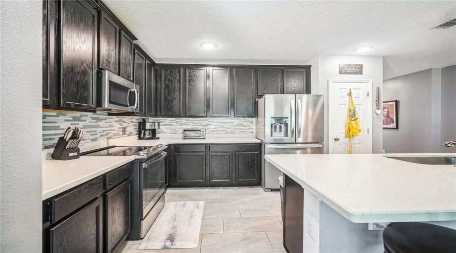 Open Floor Plan. The Kitchen Open To The Dining, Living And Porch Area With The Garden And Wooded Area.