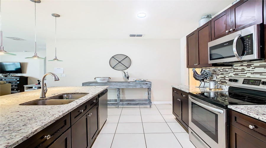 Open Concept Kitchen With Stainless Steal Appliances Included