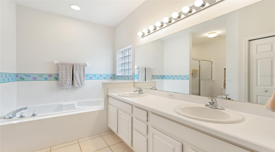 Private Bathroom With Linen And Walk-In Closets