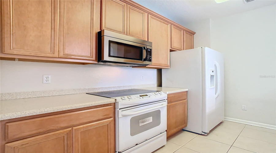 The Kitchen Provides A Refrigerator, Range, Microwave, And Dishwasher.