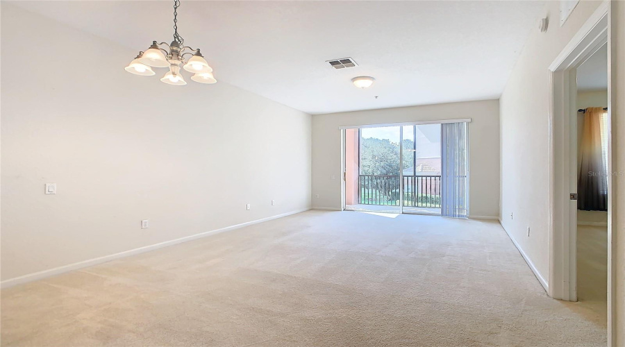 When Entering The Dining/Living Room, The Primary Bedroom Is Located On The Right.