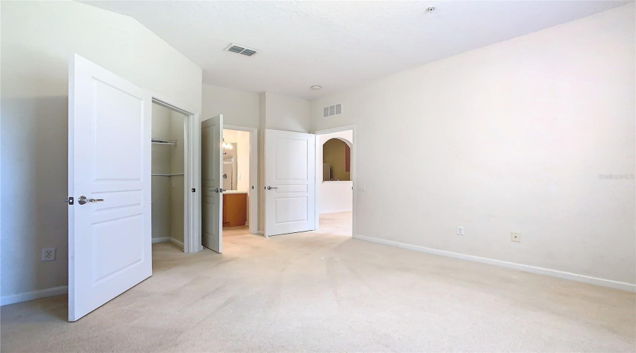 This Photos Shows The Way Out Of The Primary Bedroom To The Living Area.