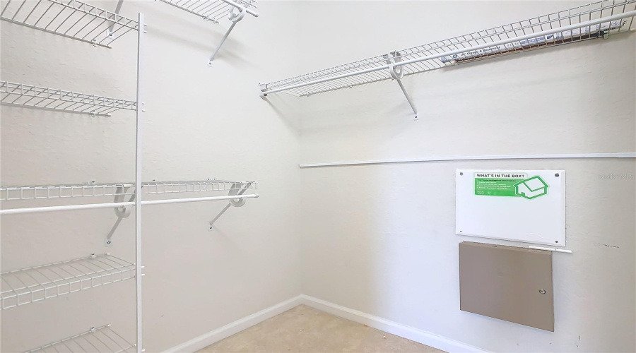 The Walk-In Closet In The Primary Bedroom.