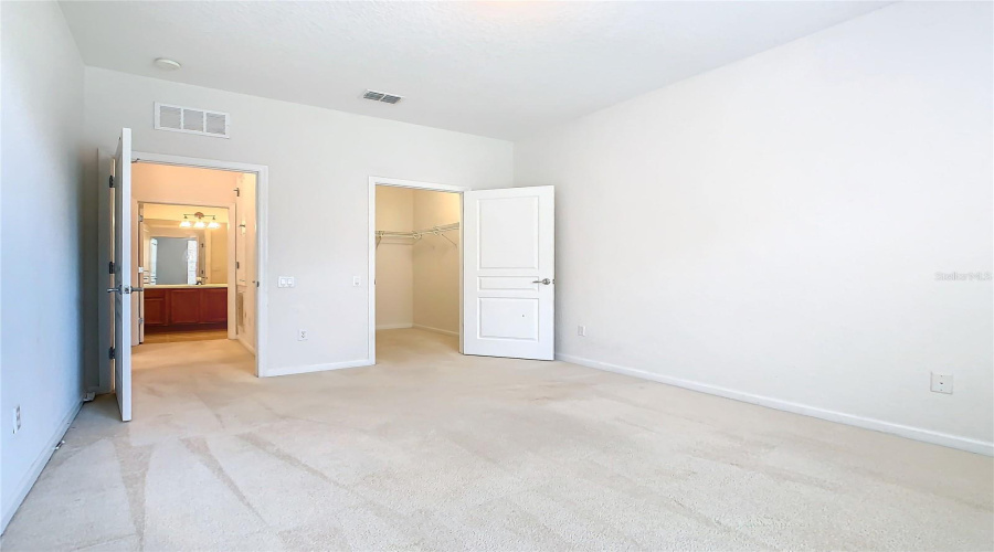 The Guest Bedroom Has A Walk-In Closet And Is Located A Short Distance To The Guest Bathroom.