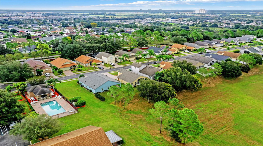 View Of Neighborhood Pool From The Back