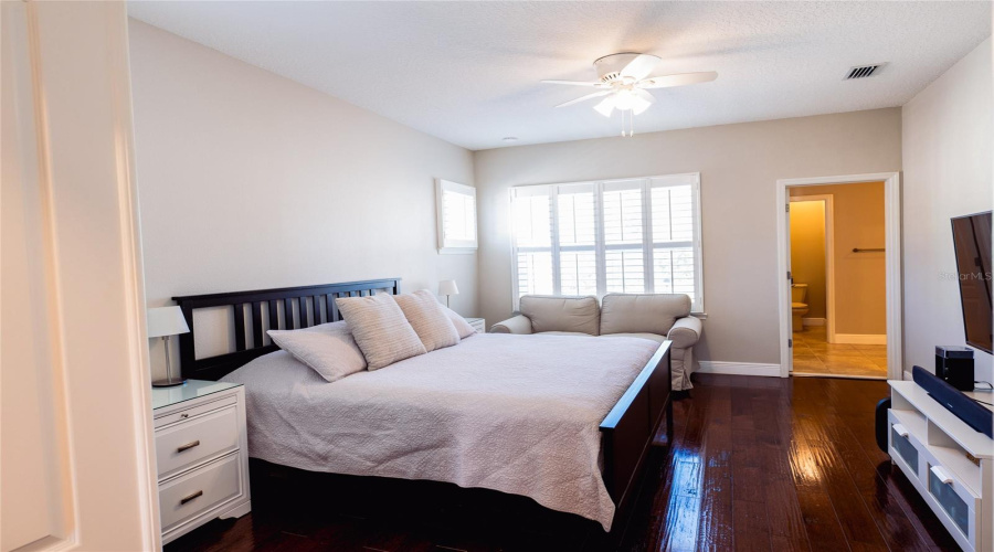 Primary Bedroom With Double Door Entrance