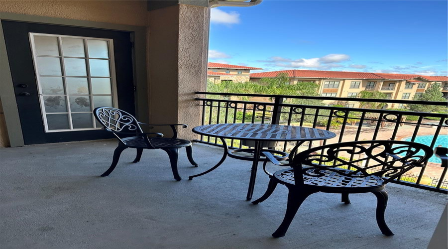 Covered patio with pool view