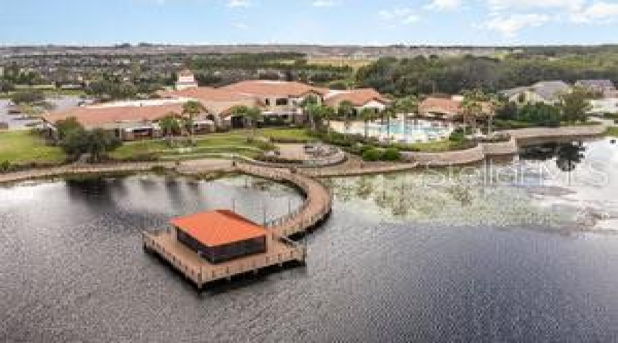 Pool And Outdoor Gazebo Overlooking Pond Area