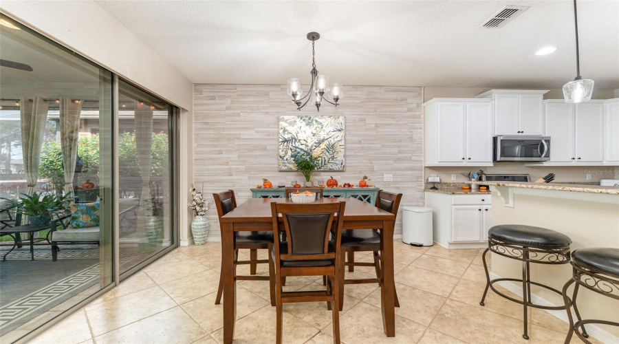 Open Dining Area With Updated Globe Fixture