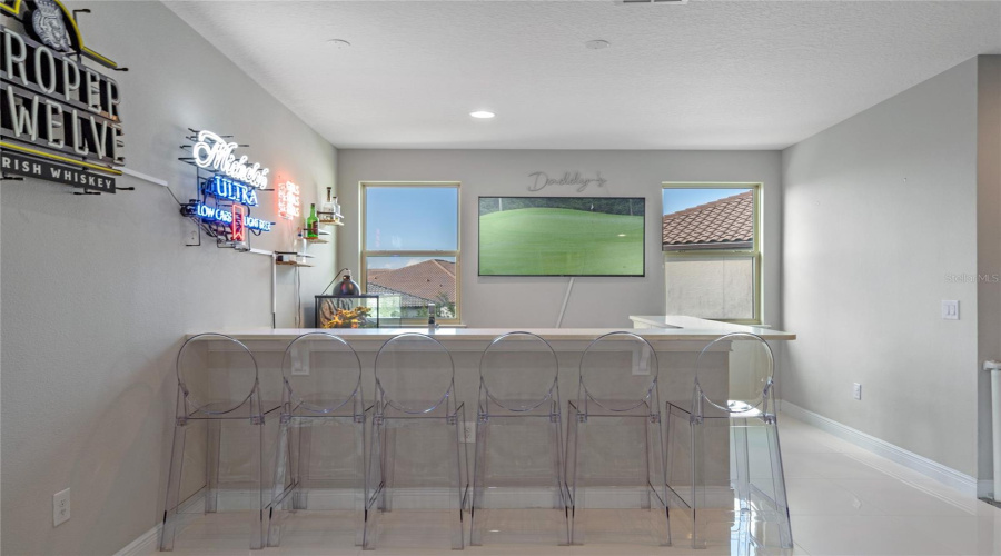 The Second Floor Loft Features A Home Bar Area.