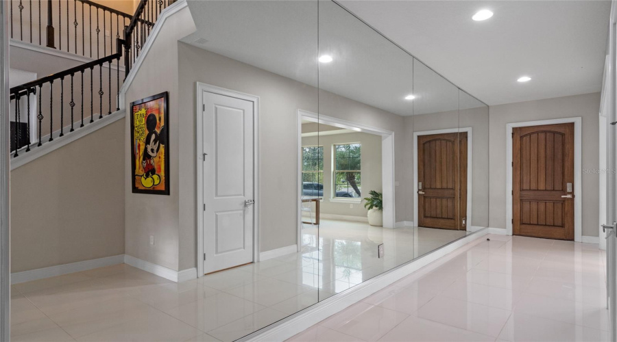 The Front Entrance Greets You With A Floor To Ceiling Mirror Wall.