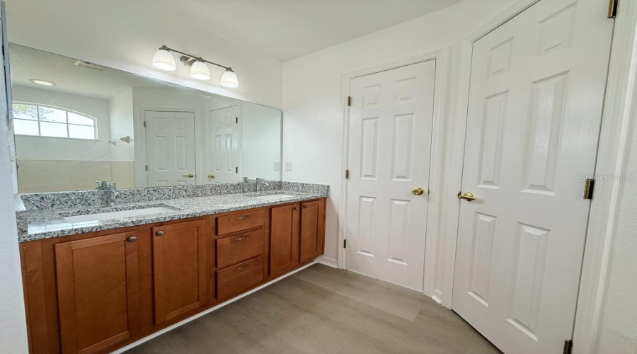 Brand New Dual Under-Mount Sinks With Granite Counter-Tops In Primary Bath.