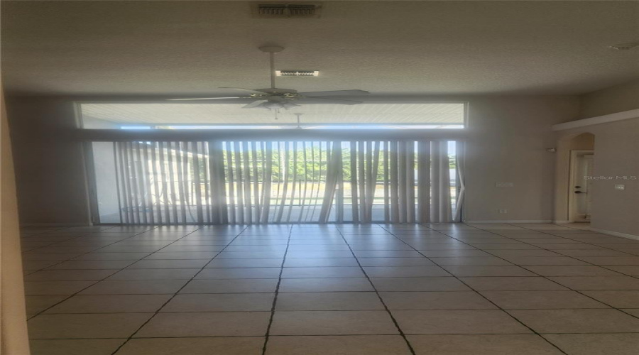 Living Room With Sliders To Pool Area