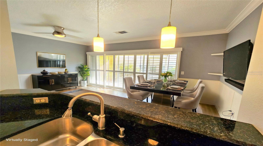 Breakfast Bar Looking Into Dining Room And Living Room - Virtually Staged