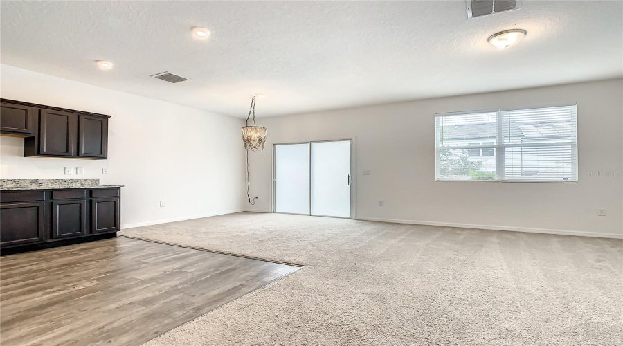 Dining area opens to fenced in backyard.  Perfect for entertaining!