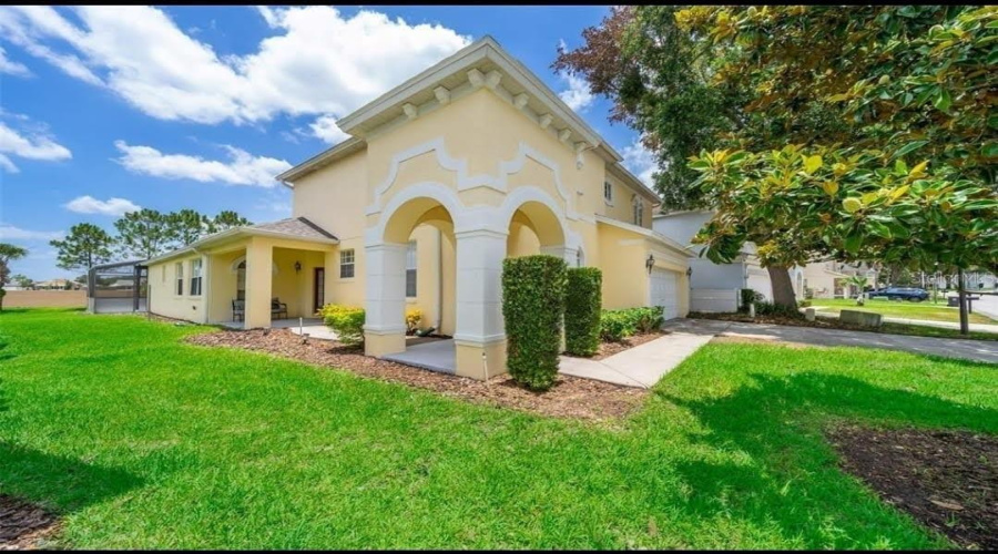 Traditional Exterior With Archways And Column Detailing.