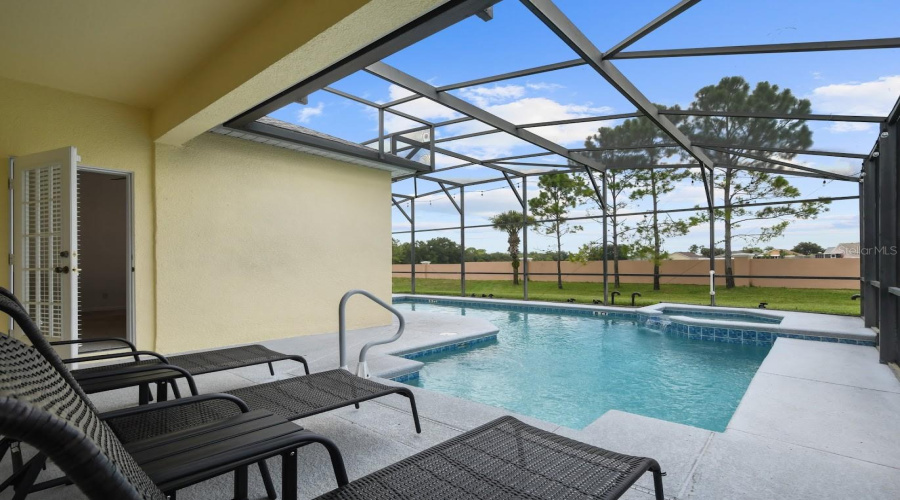 Wonderful Entertainment Area By The Pool Featuring Lounge Chairs And Deck