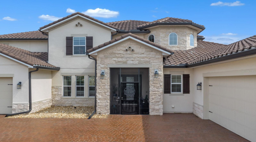 Front view with enclosed entry porch