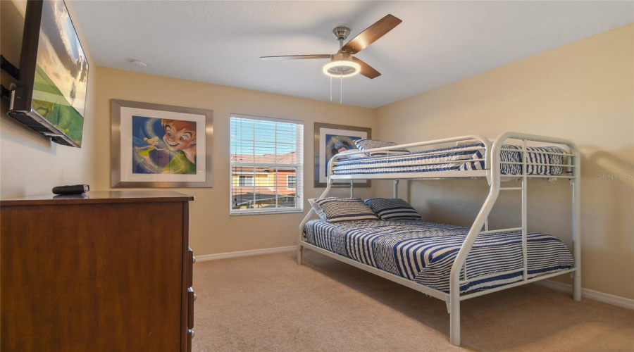 Guest Bedroom Upstairs with a bunk bed that is a queen bed on the bottom, with a single bed on top on the lower
