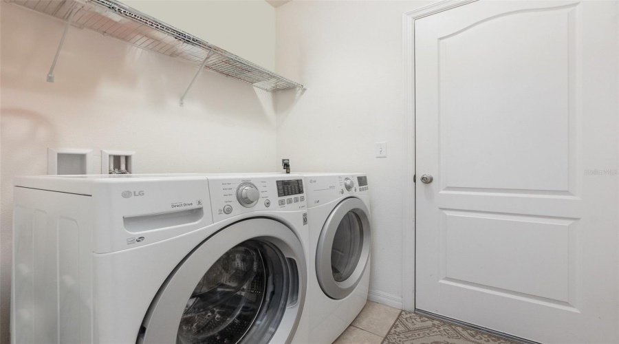 Inside Laundry Room With Front Load Washer And Dryer Included.