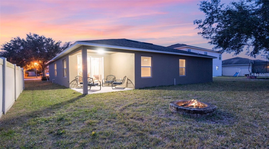 Spacious Backyard With Fire Pit.