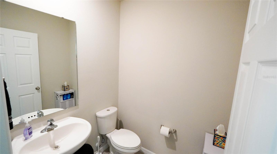 First Floor Half Bath Is Located Conveniently Between The Kitchen And Entry/Foyer.