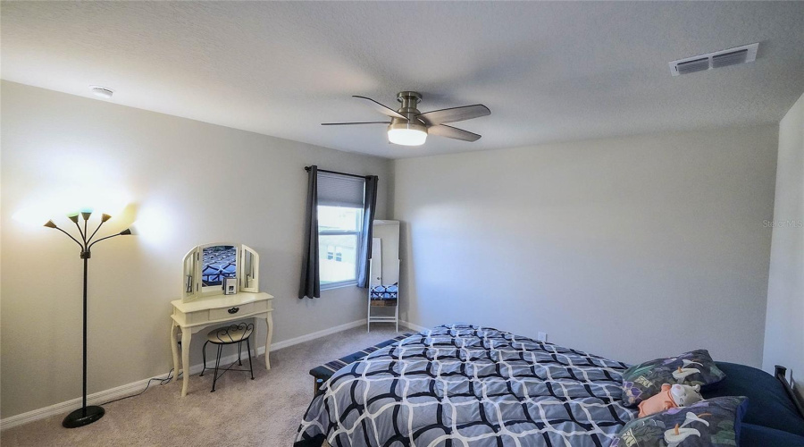 Bedroom #2 Features A Ceiling Fan And Built-In-Closet.