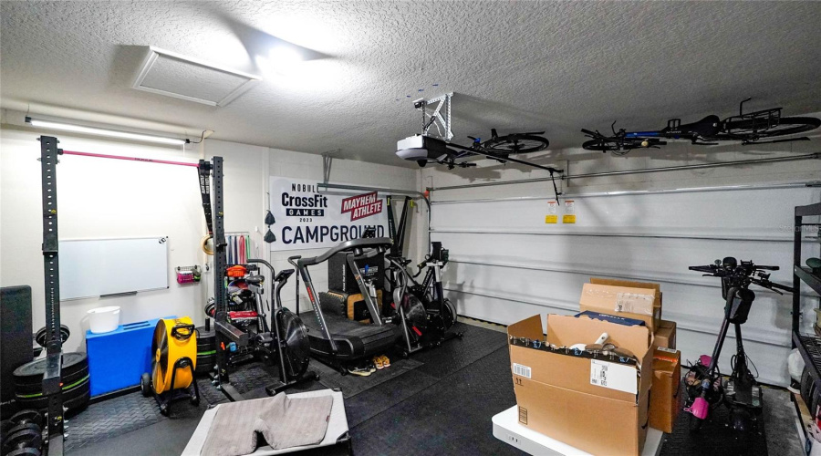 Two Car Garage Area With A Whisper Quiet Garage Door Opener.