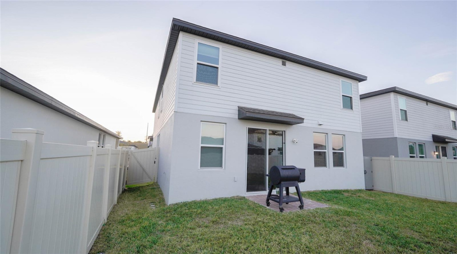 Access To The Backyard Through The Living Room Area As Well As This Side Gate.