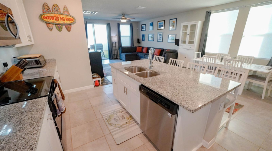 The Large Kitchen Island Provides Seating As Well As A Double Sink And Dishwasher!