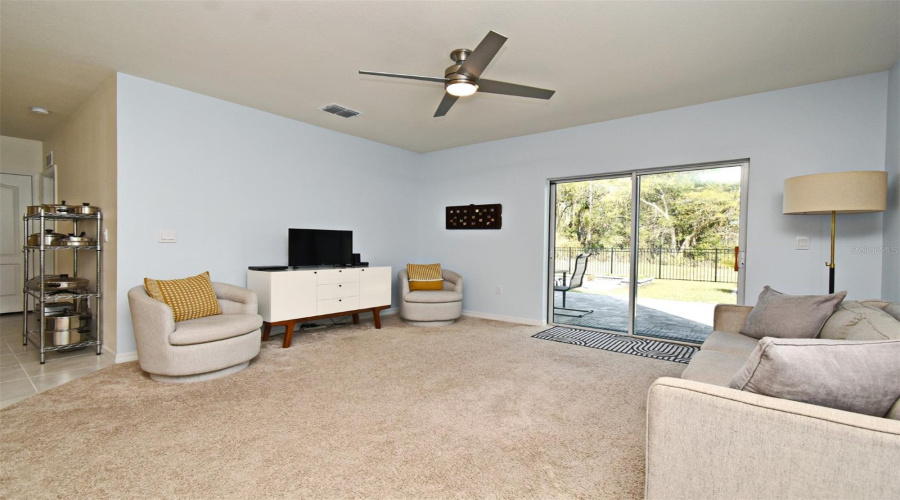 Living Room With Sliding Door To Backyard