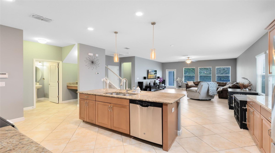 Kitchen with Drop station. Half bathroom. Living room.