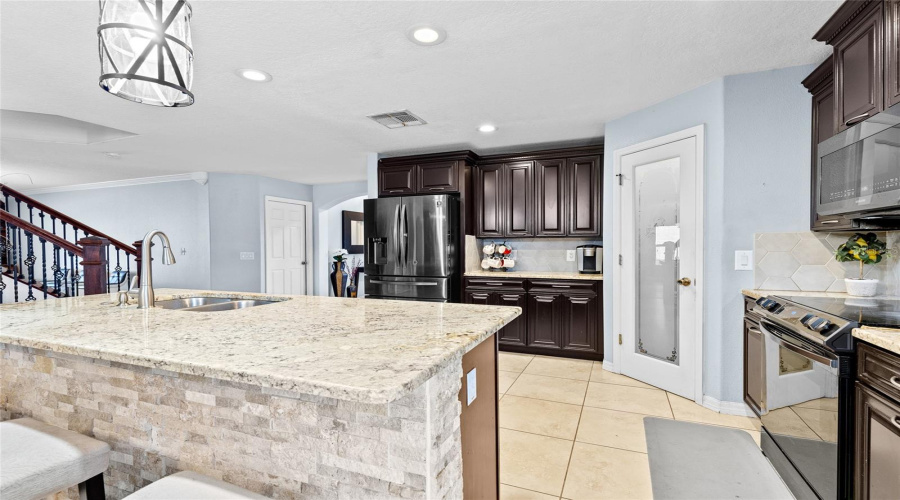 Kitchen - Massive Island Countertops (Next To Grand Staircase To Second Floor)