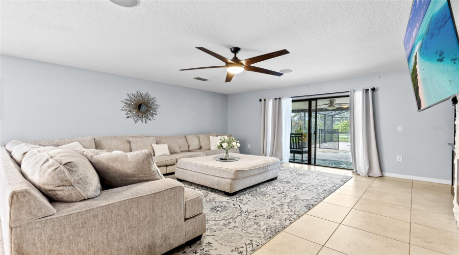 Living Room View Of Pool Through Sliding Doors