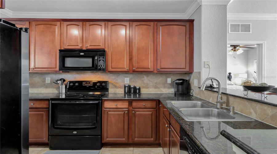 Cherry Wood Cabinetry Throughout