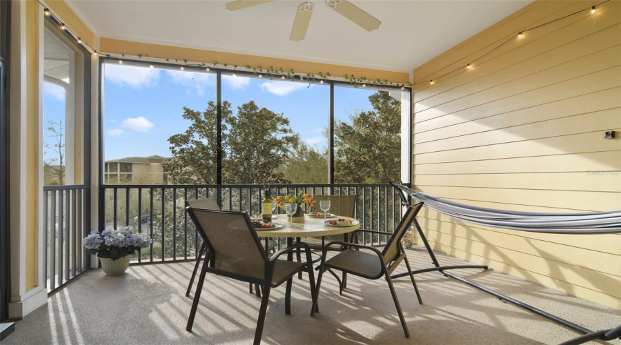 Large Screened Balcony Seen from Living Room. Gorgeous Sunsets - Perfect place to enjoy a shaded  Florida Breeze!