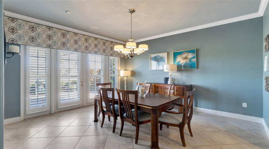 Formal Dining Room, With Views Through The French Doors To The Golf Course Out Back