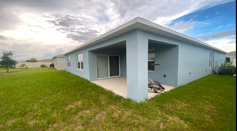 Rear corner of home showing lanai.