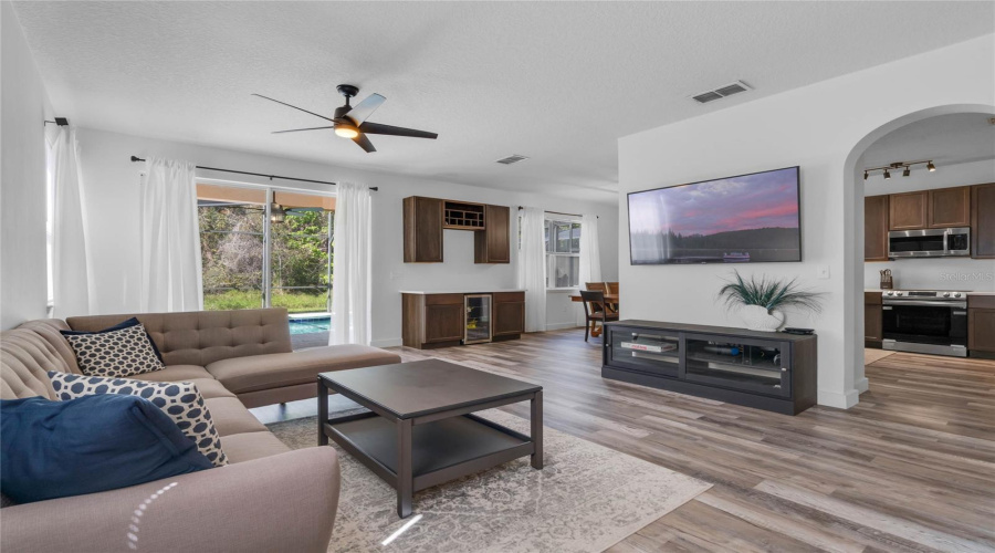 View Of Family Room From Entry Overlooking Kitchen And Backyard