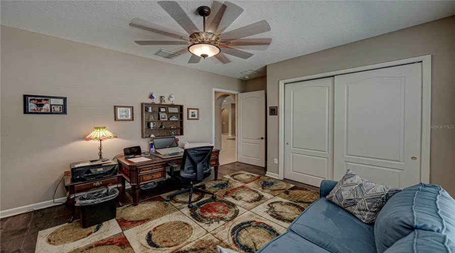 Bedroom/Office.that Is An Area Rug On The Floor